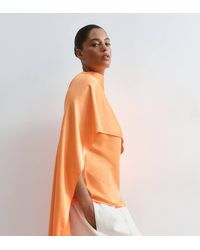 ARRANGE - Curve Satin Underlay Cape Top - Lyst