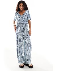 Monki - Shirt Sleeve Jumpsuit With Wrap Front - Lyst