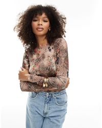 ASOS - T-shirt court en tulle à manches longues avec imprimé léopard et fleurs - Lyst