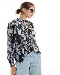 Mango - Blouse à fleurs nouée au col - Lyst