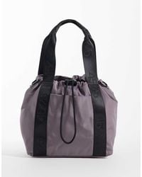 4505 - Woven Adjustable Drawstring Bucket Bag With External Pocket - Lyst