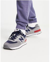 New Balance - 574 - sneakers grigie e nere - Lyst