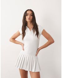 4505 - Robe style tennis à col polo et jupe plissée - Lyst