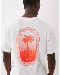 Nike - T-shirt oversize à logo et imprimé palmier au dos - Lyst