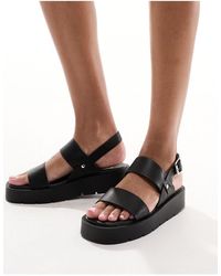 Schuh - Tayla - sandali neri con doppie fascette e cinturino posteriore - Lyst