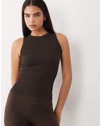 4505 - Seamless Lightweight Ribbed 90s Racer Tank Top - Lyst