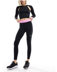 Nike - Nike Pro Training 365 Mid Rise leggings - Lyst