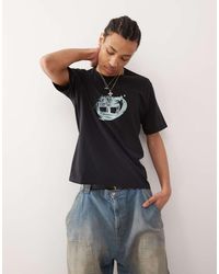 Timberland - T-Shirt Nera Con Stampa Del Logo Sul Petto - Lyst