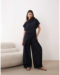 ARRANGE - Denim Broek Met Geplooid Detail - Lyst