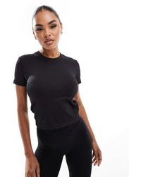 4505 - Camiseta Negra Con Diseño Encogido Sin Costuras Icon De - Lyst