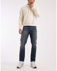 ASOS - Vaqueros Elásticos De Corte Slim Con Lavado Azul Medio Y Lavado Vintage De - Lyst