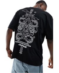 ASOS - T-shirt oversize nera con stampa "souvenir" sul retro - Lyst