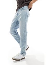 Hollister - Jeans dritti slim lavaggio chiaro - Lyst