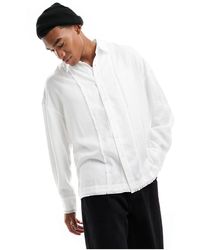 Reclaimed (vintage) - Camicia a maniche lunghe invecchiata bianca con dettagli sfrangiati - Lyst