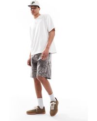 Hollister - Pantalones Cortos Vaqueros Por La Rodilla Holgados De Estilo Carpintero Con Estampado De Camuflaje De -Verde - Lyst