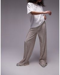 TOPSHOP - Pantaloni a fondo ampio stropicciati plissé color pietra - Lyst