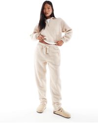ASOS - Asos design petite – lounge-set aus sweatshirt mit reißverschluss-kragen und schmal zulaufender hose aus teddyfell - Lyst