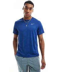 Nike - Camiseta azul real dri-fit miler - Lyst