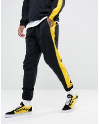 Granted Sweatpants In Black Nylon With Yellow Stripe