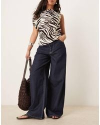 Mango - Broek Met Denim Look, Elastische Taille En Wijde Pijpen - Lyst