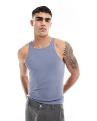 ASOS - Camiseta azul ajustada sin mangas con cuello subido - Lyst