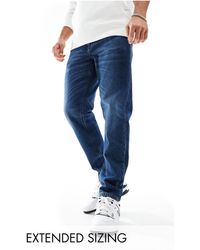 ASOS - Jeans stretch affusolati lavaggio vintage scuro - Lyst