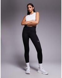 PUMA - Leggings Negros De Talle Alto Essential De - Lyst