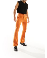 ASOS - Pantaloni skinny eleganti a zampa arancioni - Lyst