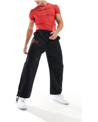 Ed Hardy - Pantalones s holgados técnicos con diseño bordado - Lyst