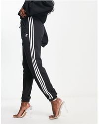 adidas Originals - Adicolor Three Stripe Cuffed joggers - Lyst