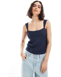 Hollister - Top en lin sans manches noué dans le dos - à pois - Lyst