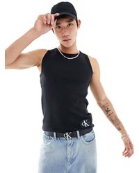 Calvin Klein - Camiseta negra sin mangas con parche - Lyst
