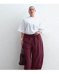 ARRANGE - Curve Willa Elasticated Waist Drawstring Trousers - Lyst