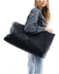 ASOS - Maxi borsa nera con zip e manici intessuti - Lyst