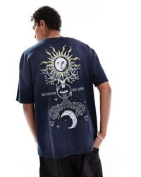 ASOS - T-shirt oversize scuro slavato con stampa celestiale sul retro - Lyst