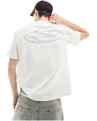 Timberland - Camiseta blanco hueso con logo reflectante en la espalda - Lyst