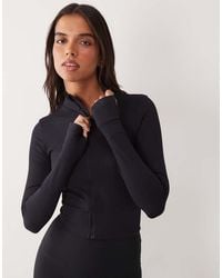 4505 - Seamless Baby Rib Cropped Zip Up Long Sleeve Top - Lyst