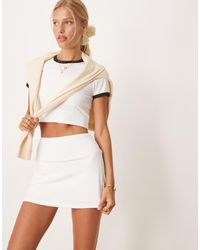 4505 - Gonna Da Tennis Bianca Con Pantaloncini Integrati E Tasca Per Cellulare - Lyst