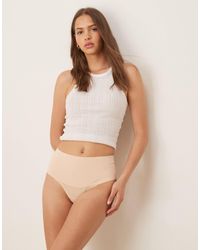 Spanx - Supersmooth Undietectable Tanga Brief - Lyst