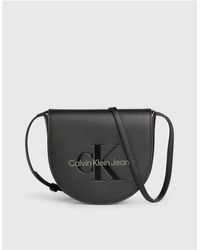 Calvin Klein - Petit sac style portefeuille à bandoulière - /genévrier foncé - Lyst