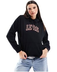 Levi's - Felpa nera con cappuccio e logo sportivo piccolo - Lyst