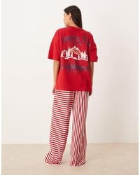 ASOS - Oversized Pyjamaset Met T-Shirt Met Grafische 'Après-Ski'-Print En Broek Met Wijde Pijpen - Lyst