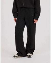 CERNUCCI - Knitted Embroidered Logo Wide Leg Jogger - Lyst