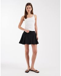 ASOS - Minigonna Nera Testurizzata Con Vita Scesa E Inserti - Lyst