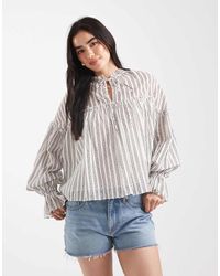 ASOS - Top A Maniche Lunghe Stile Grembiule Rigato Stropicciato Allacciato Sul Collo E Con Volant - Lyst