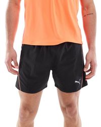 PUMA - Pantalones Cortos Negros Con Ribetes Rojos Run Velocity De - Lyst