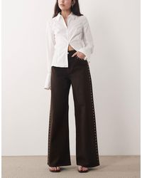 Mango - Jean ample en coton à clous - chocolat - Lyst