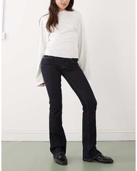 Weekday - Luna Low Waisted Skinny Bootcut Jeans - Lyst