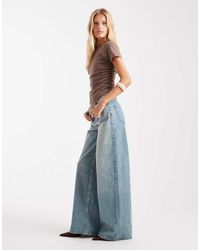 ASOS - Vaqueros De Pernera Ancha Y Talle Alto Con Lavado Vintage Y Detalle De Tira Ajustable De -Azul - Lyst