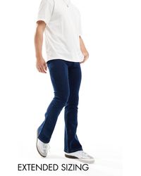 ASOS - Jeans a zampa elasticizzati lavaggio scuro - Lyst